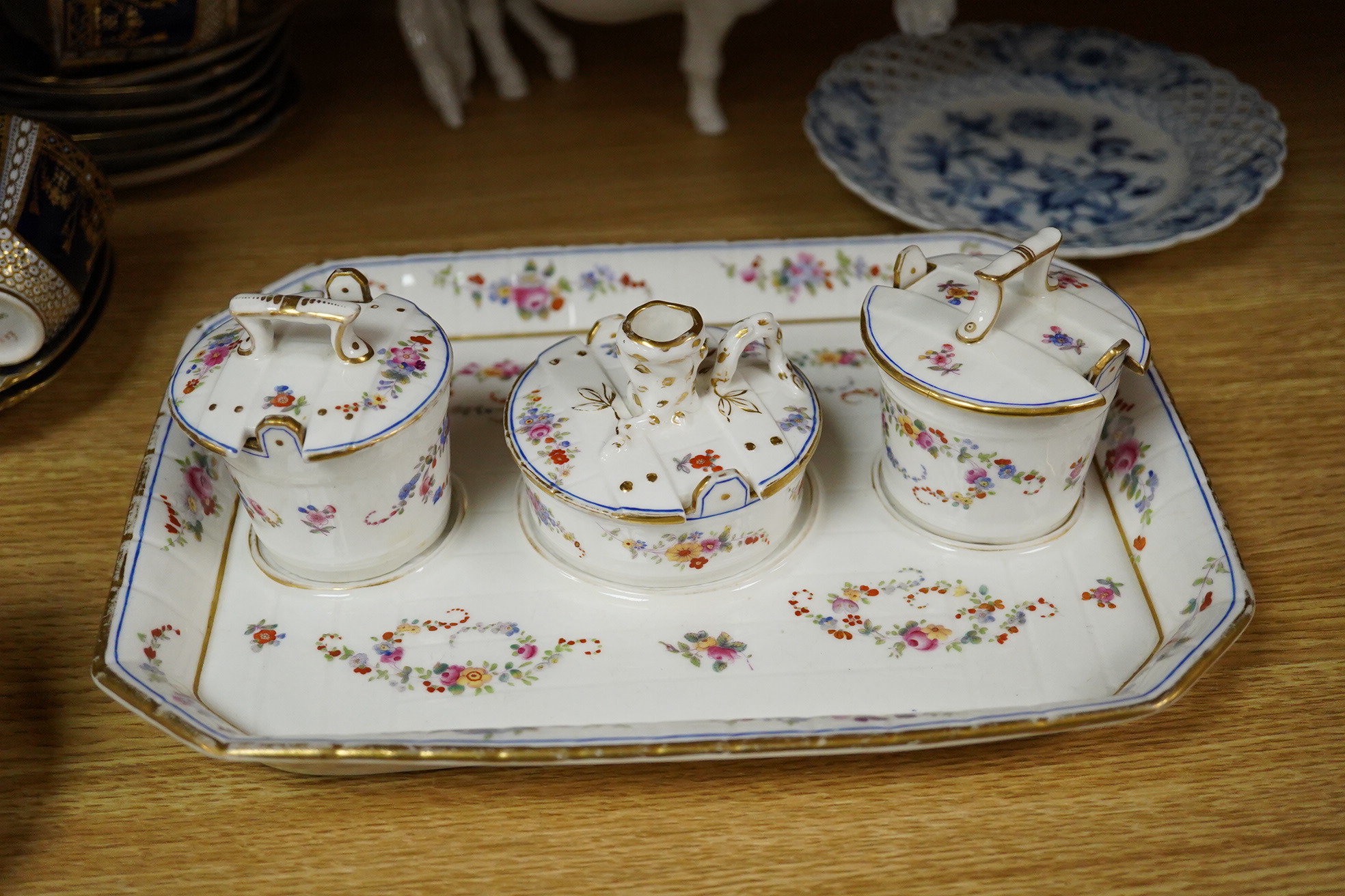 A collection of Coalport porcelain to include cups and saucers, a Meissen Pony, Meissen blue and white plate and a 19th century desk stand, largest 25cm wide